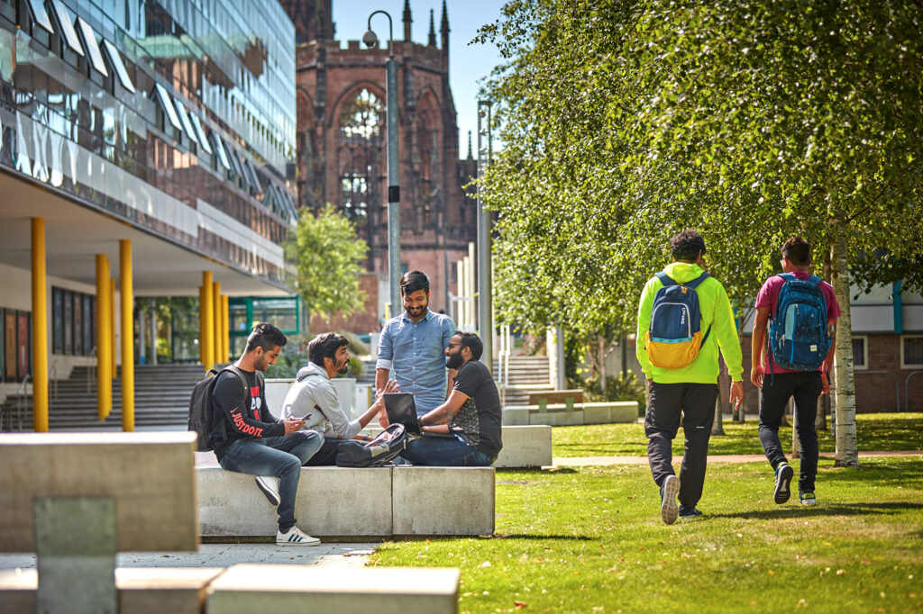 Students walking and talking near ONE Friargate offices